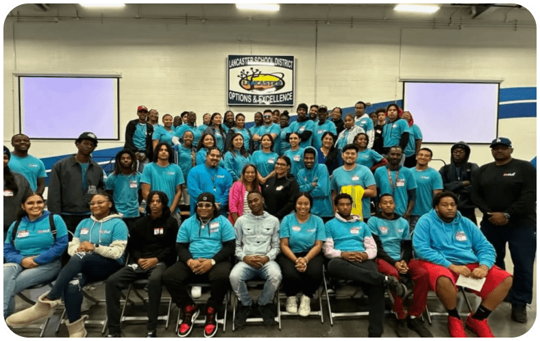 Group photo of people in matching shirts.